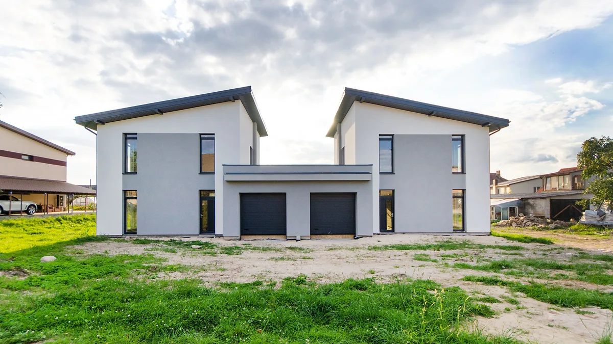 Twin newly built houses with symmetrical modern architecture