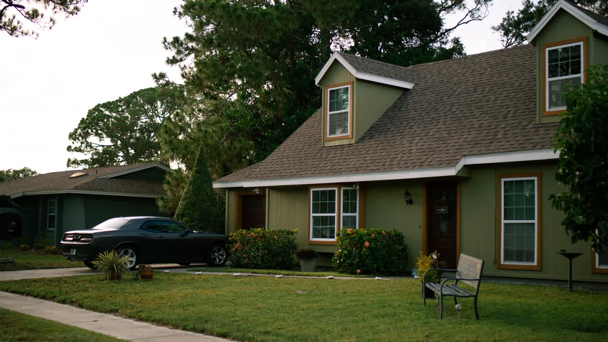 Suburban home with a well-maintained green lawn