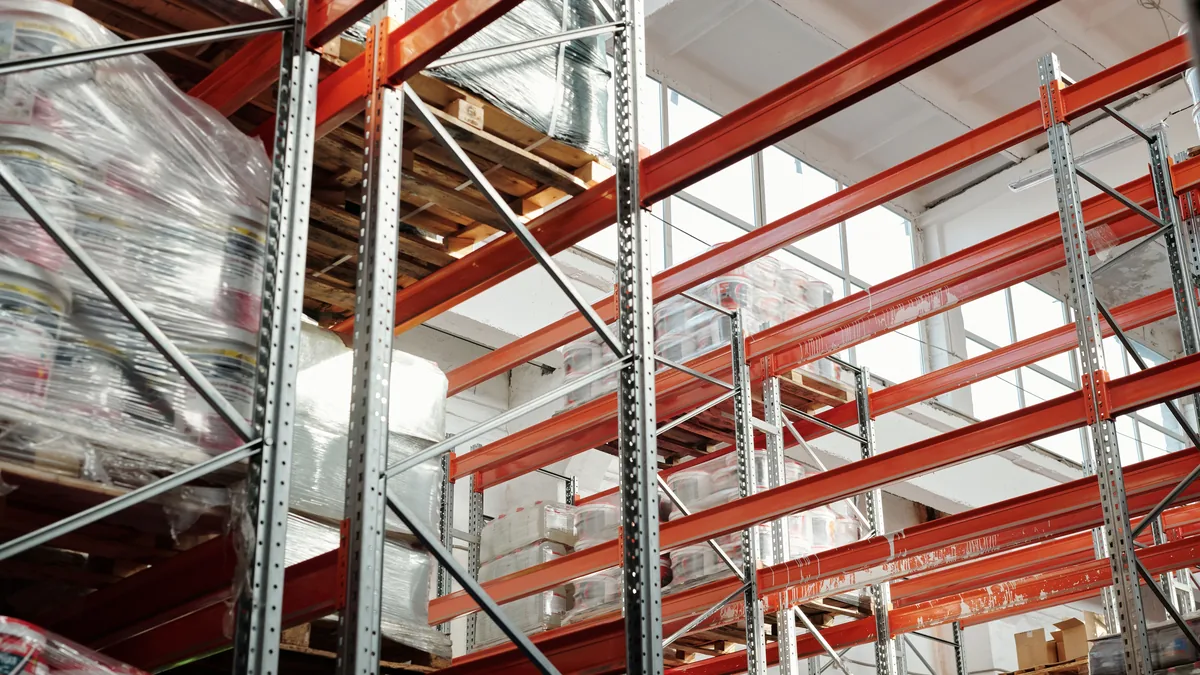 Warehouse interior with pallet racking and a wide concrete floor